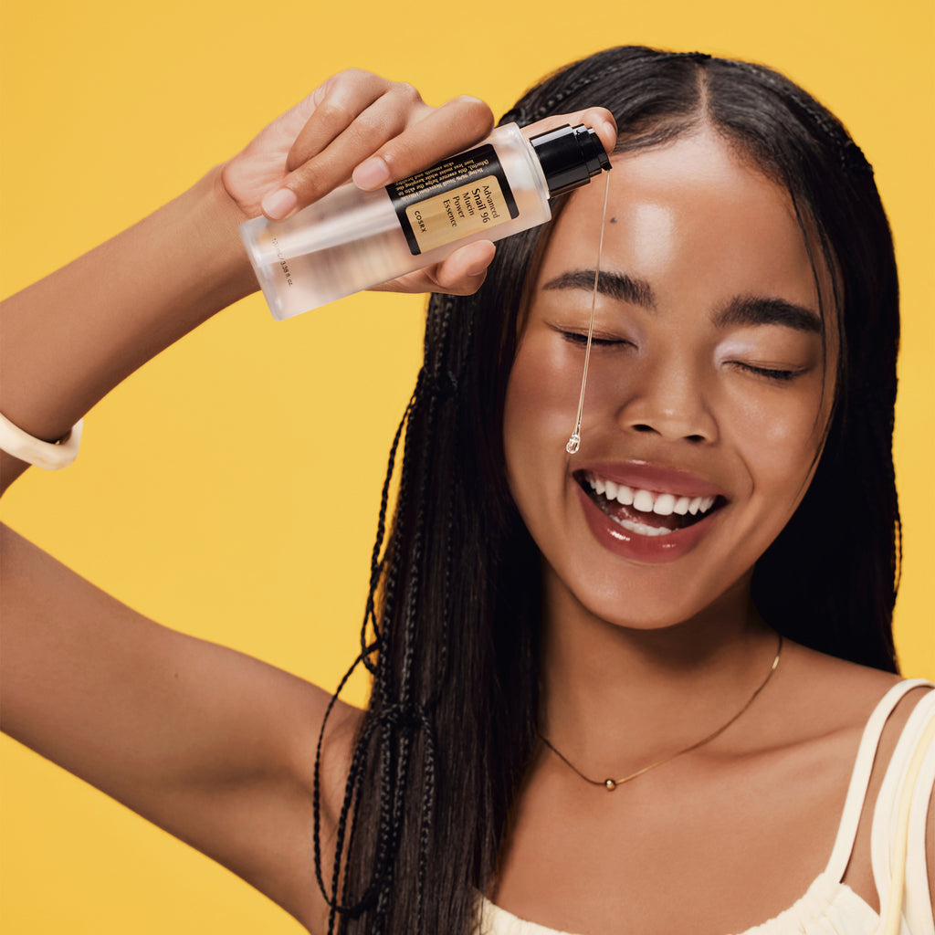 COSRX Advanced Snail 96 Mucin Power Essence 100ml bottle with model