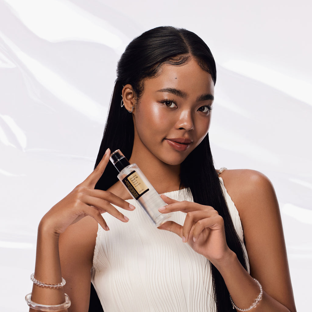 COSRX Advanced Snail 96 Mucin Power Essence 100ml bottle with model