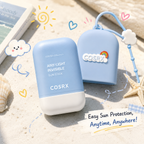 Two blue sun stick containers with COSRX branding on a sandy background.
